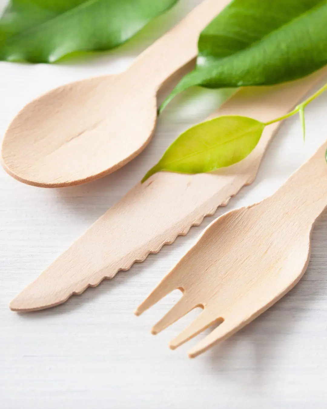 Disposable wooden cutlery — a spoon, knife and fork